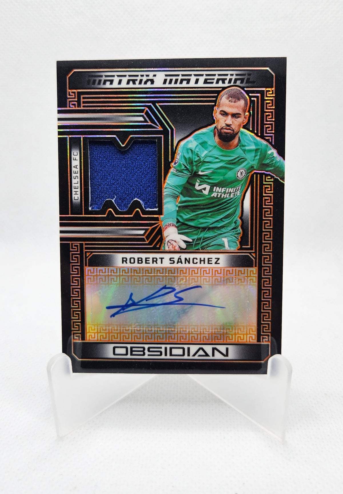 Robert Sánchez /99 - Autógrafo original y Parche - Obsidian Soccer 23/24